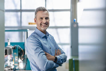 Portrait of a confident businessman in a factory - DIGF10129