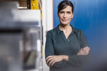 Portrait of a confident businesswoman in a factory - DIGF10147