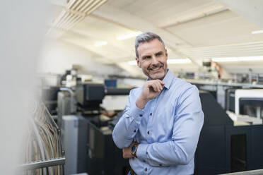 Portrait of a confident businessman in a factory - DIGF10237