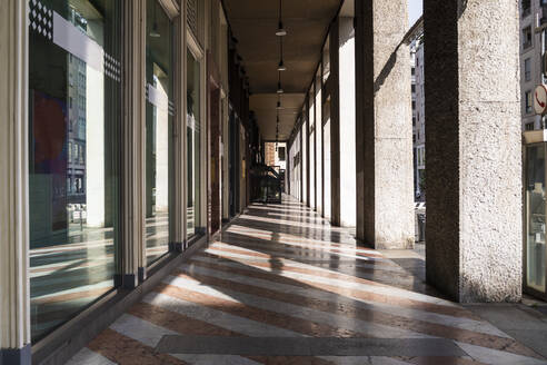 Italy, Milan, Empty sidewalk during COVID-19 outbreak - MEUF00559