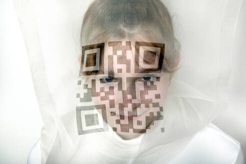 Portrait of teenage girl wearing transparent mask with QR Code - PSTF00742