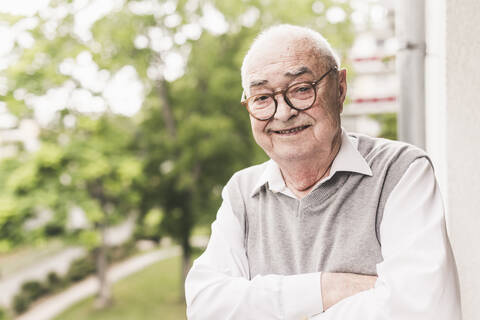 Portrait of smiling senior man wearing glasses stock photo