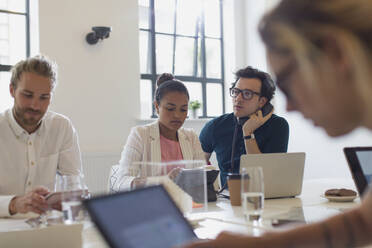 Focused business people working in conference room meeting - CAIF26794