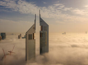 Aerial view of buildings surrounded by clouds Dubai, United Arab Emirates - AAEF08088