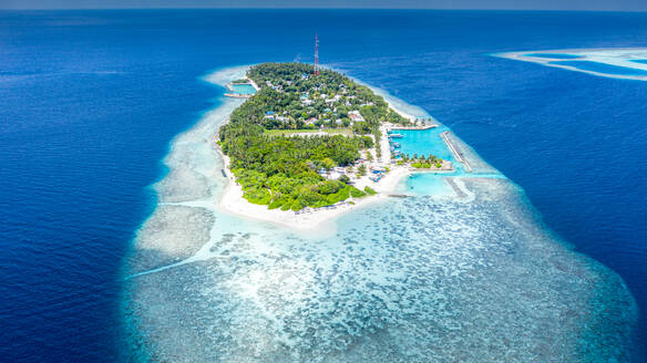 Aerial view of local island Hangnaameedhoo, located in Ari Atoll, Maldives, Indian Ocean with reef, harbour, local beach, bikini / guest beach - AAEF08294