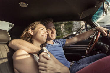 Couple in love relaxing in vintage car - SDAHF00813