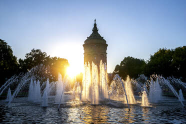 Germany, Baden-Wurttemberg, Mannheim, Wasserturm fountain at sunset - PUF01877