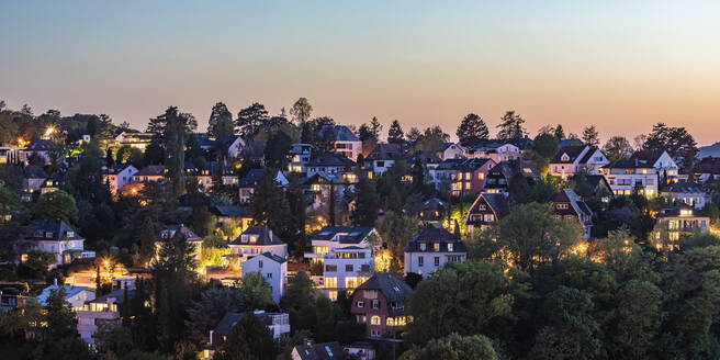 Germany, Baden-Wurttemberg, Stuttgart, Clear sky over wooded residential district at dusk - WDF05985