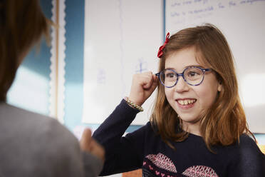 Portrait of smiling girl in a class during a lesson - PWF00061