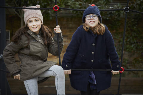 Two girls on the schoolyard playground during break time stock photo