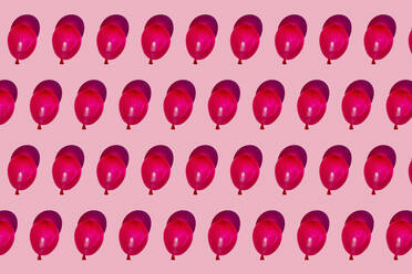 Pattern of rows of red water balloons - GEMF03612