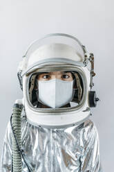 Boy wearing space suit and protective mask - JCMF00677