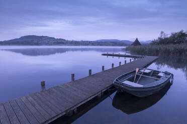 Moored boat on a wooden jetty on Llangorse Lake, Brecon Beacons, Powys, Wales, United Kingdom, Europe - RHPLF14921