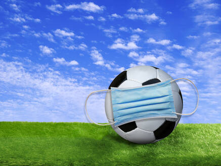 3D rendering, Soccer ball covered by surgigal mask on soccer field - BSCF00620