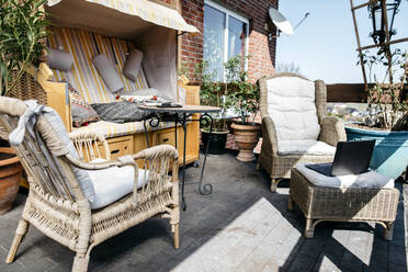 Terrace with garden furniture and laptop - KMKF01309