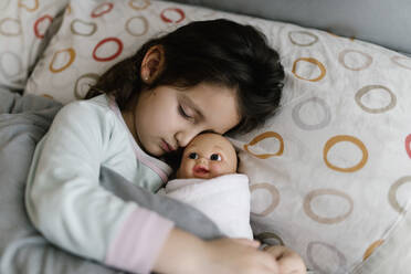 Sleeping little girl with her doll - EGAF00042