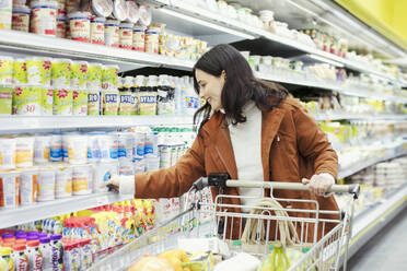 Woman shopping in supermarket - CAIF27323