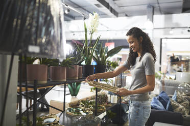 Woman shopping in home decor shop - CAIF27423