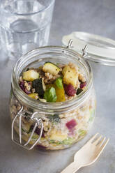 Jar of gluten free vegan salad with buckwheat, zucchini and paprika - EVGF03609