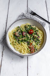 Plate of spaghetti with spinach, salmon and tomatoes - SARF04562