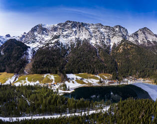 Germany, Bavaria, Ramsau bei Berchtesgaden, Helicopter view of Hintersee lake and Reiter Alpe range at winter dawn - AMF08075