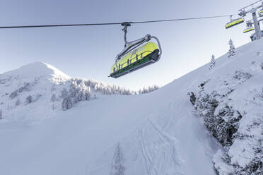 Austria, Styria, Schladming, Low angle view of Planai chairlifts - WFF00422