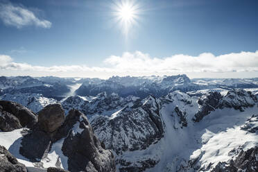 Italy, Trentino, Sun shining over scenic landscape seen from summit of Marmolada mountain - WFF00442