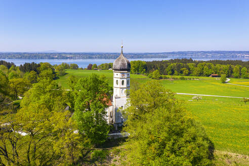 Germany, Bavaria, Munsing, Drone view of Church of Assumption of Virgin Mary in spring - SIEF09822