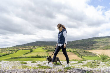 Woman going walkies with her bulldog, Castilla La Mancha, Spain - OCMF01209