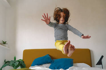 Cute Toddler Boy Jumping On The Bed Stock Photo - Download Image Now - Baby  - Human Age, Jumping, Child - iStock