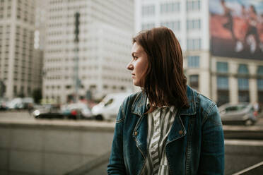 Germany, Berlin, Portrait of young brunette wearing denim jacket - VBF00044