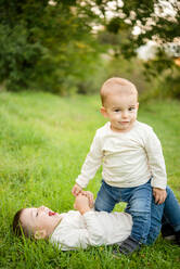 Portrait of two young boys playing in a meadow. - ISF24159