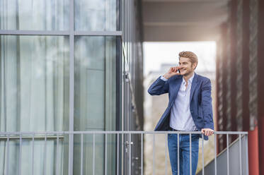 Young businessman on the phone at an office building - DIGF10928