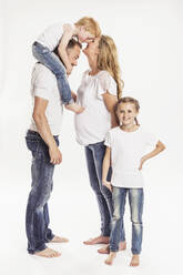 Pregnant woman with husband and two children standing in front of white background - SDAHF00945