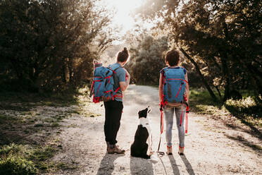 Couple with dog on a hiking trip - EBBF00023
