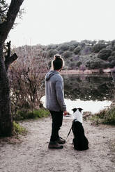 Man with his dog at lakeside - EBBF00056