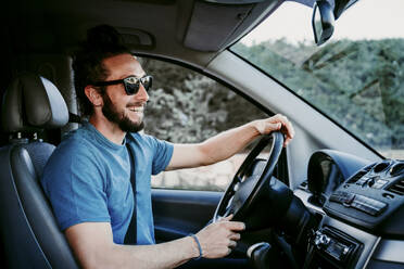 Happy man driving car - EBBF00067