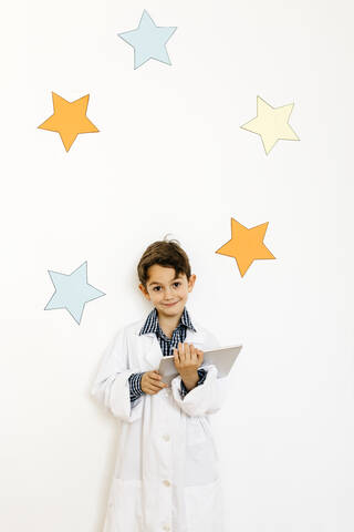 Boy with clipboard playing researcher stock photo