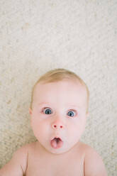 Closeup of baby making funny face at the camera - CAVF80875