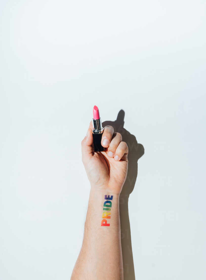 Nail polish tattoo located on the inner forearm.