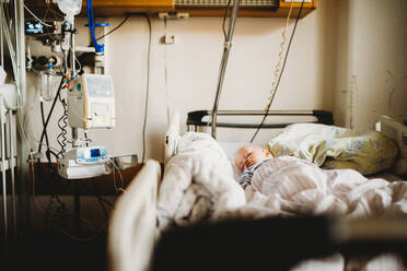 Baby child sick at the hospital with a virus coronavirus - CAVF80981