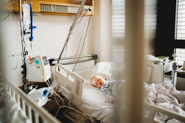 Baby child sick at the hospital with a virus coronavirus - CAVF80984