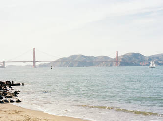 Golden Gate bridge from the shore of San Francisco with Sailboat - CAVF81349