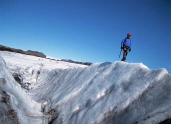 Man exploring the glacier Solheimajokull in Iceland - CAVF81912