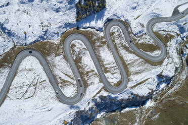 Switzerland, Canton of Grisons, Drone view of winding road in Julier Pass - RUEF02945