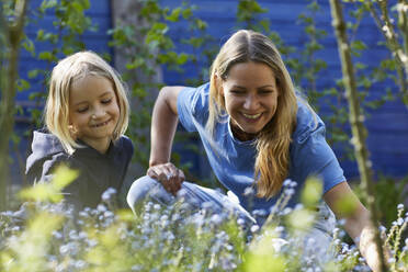 Happy mother and daughter in allotment garden - MCF00822