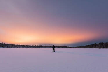 Snowshoe hiker in winter landscape, Hetta, Enontekioe, Finland - WVF01559