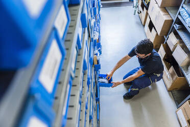 Man in storage room of a factory - DIGF11340