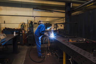 Welder welding metal in a factory - DIGF11357