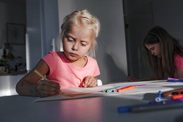 Cute girl coloring on paper at home - OGF00426